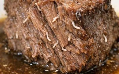 Pulled my beef roast out of the slow cooker and saw these weird white stringy things poking out of the meat. They look like little worms or parasites.