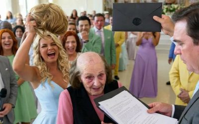 My daughter-in-law ripped off my wife’s wig at my son’s wedding, revealing the traces of months of treatment while some guests laughed. I went on stage, covered my wife with my jacket, and opened the wedding envelope… When she saw the documents inside, her smile suddenly…