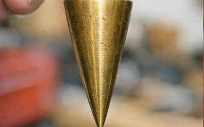 Found this heavy pointed brass weight in my dad’s old toolbox. It has a string attached.