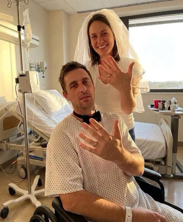 I married my childhood sweetheart in his hospital room after doctors said he had only months to live—right after we said “I do,” a nurse whispered, “Before you leave… look under his mattress.” I met Ben when we were eight. He was the boy who always carried my backpack when it was too heavy and slipped the biggest cookie onto my lunch tray when he thought I wasn’t looking. By sixteen, everyone already joked we’d end up together. They were right. Two months before our wedding, Ben collapsed at work. The diagnosis shattered everything. An aggressive cancer. Too advanced. Too late. The doctors quietly told us he probably had only a few months left. I remember looking at the wedding invitations we’d already mailed and thinking, None of this matters anymore. So we canceled everything. No ballroom. No flowers. No first dance. Instead, I asked a hospital chaplain to marry us in Ben’s room. I wore my favorite blue jeans, a white shirt, and a cheap veil one of the nurses found at a party store during her lunch break. Ben insisted on wearing the ridiculous black bow tie I’d bought him for our original wedding. It looked absurd with his hospital pajamas. He said, “A groom has standards.” Everyone cried. Even the nurses. After the ceremony, Ben squeezed my hand and whispered, “Best day of my life.” I truly believed it was mine too. Then one of the nurses caught me alone in the hallway. She glanced toward Ben’s room to make sure he couldn’t hear us. Then quietly said, “Don’t tell him I told you this.” My heart stopped. She leaned closer. “Before you leave tonight…” “Look under his mattress. He’s lying to you. He and his doctor have A PLAN.” “He doesn’t know I’ve seen it.” Then she disappeared. I walked back into my new husband’s room, smiling like nothing had happened. But all I could think about… was what the man I’d loved for twenty years could possibly be hiding beneath his hospital bed. I waited until Ben slowly shuffled toward the bathroom with his IV pole. The second the door clicked shut… I carefully lifted the edge of the mattress. What I saw there made my knees buckle. ⬇️ Voir moins