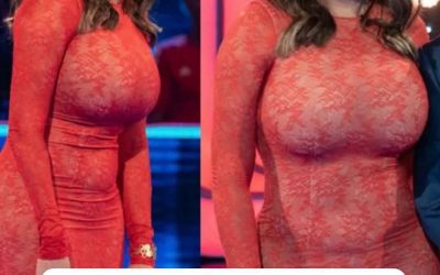 Carol Vorderman flaunts her toned abs and buxom bottom