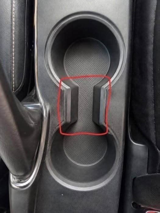 What Is the Weird Gap Between Car Cup Holders For? (And Why It’s Actually Brilliant)