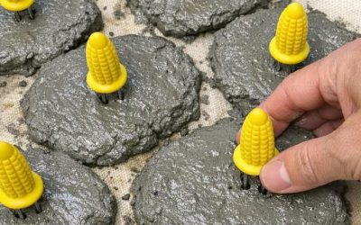 Press plastic corn cob holders into wet cement and 1 household item, and this turns into something unbelievable