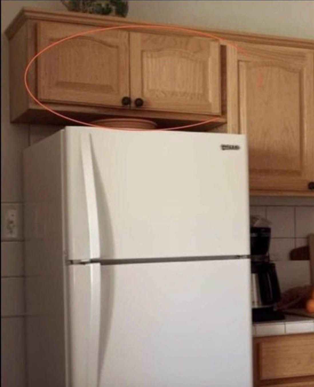 Here’s what the cupboards above your fridge are for